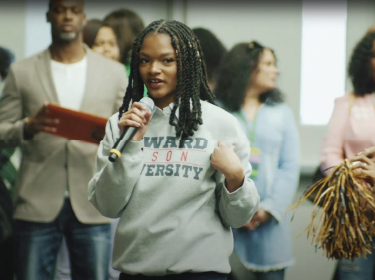 a girl holding a mic